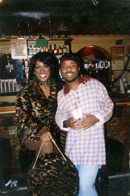 Treshawn Seymour and Danny Cashmere radiantly smile to the camera in front of Soakie's bar.
