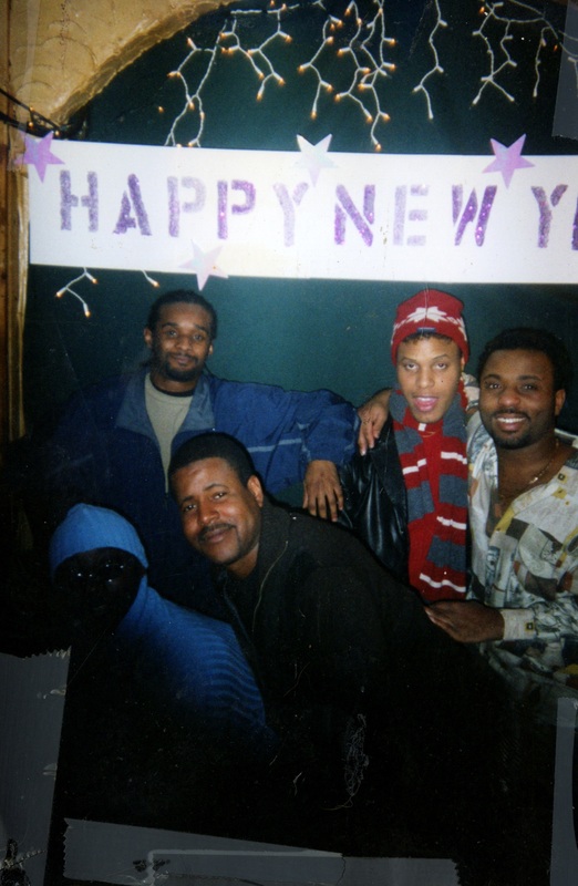 Five of Soakie's patrons pose in front of a banner displaying "Happy New Year".