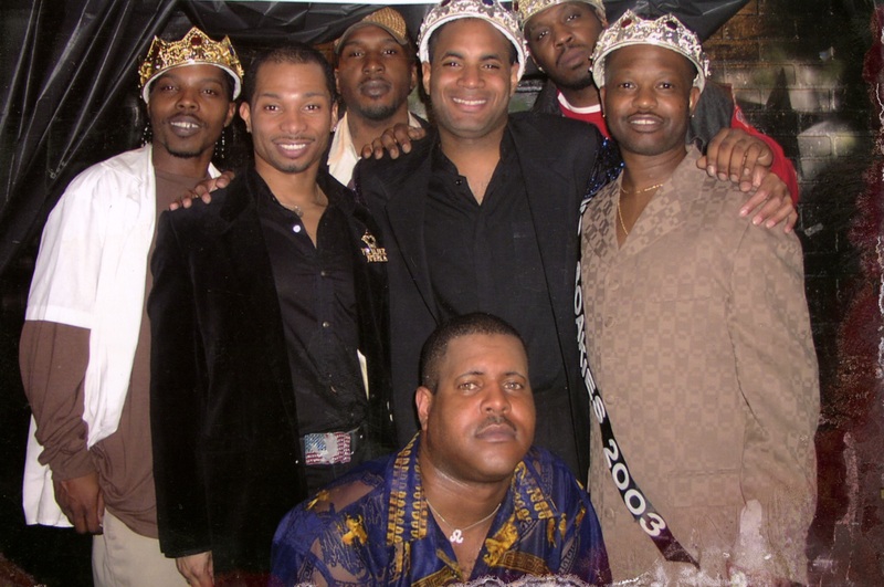 A group of Soakie's performers pose for the camera together. A few adorn crowns. 