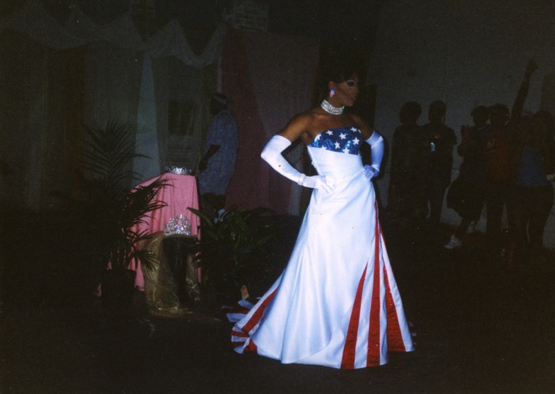 A feminine performer at Soakie's poses in an American flag-themed dress. 
