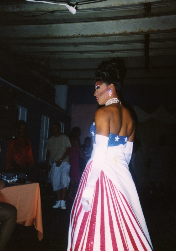 A feminine performer at Soakie's looks to the judge's table.